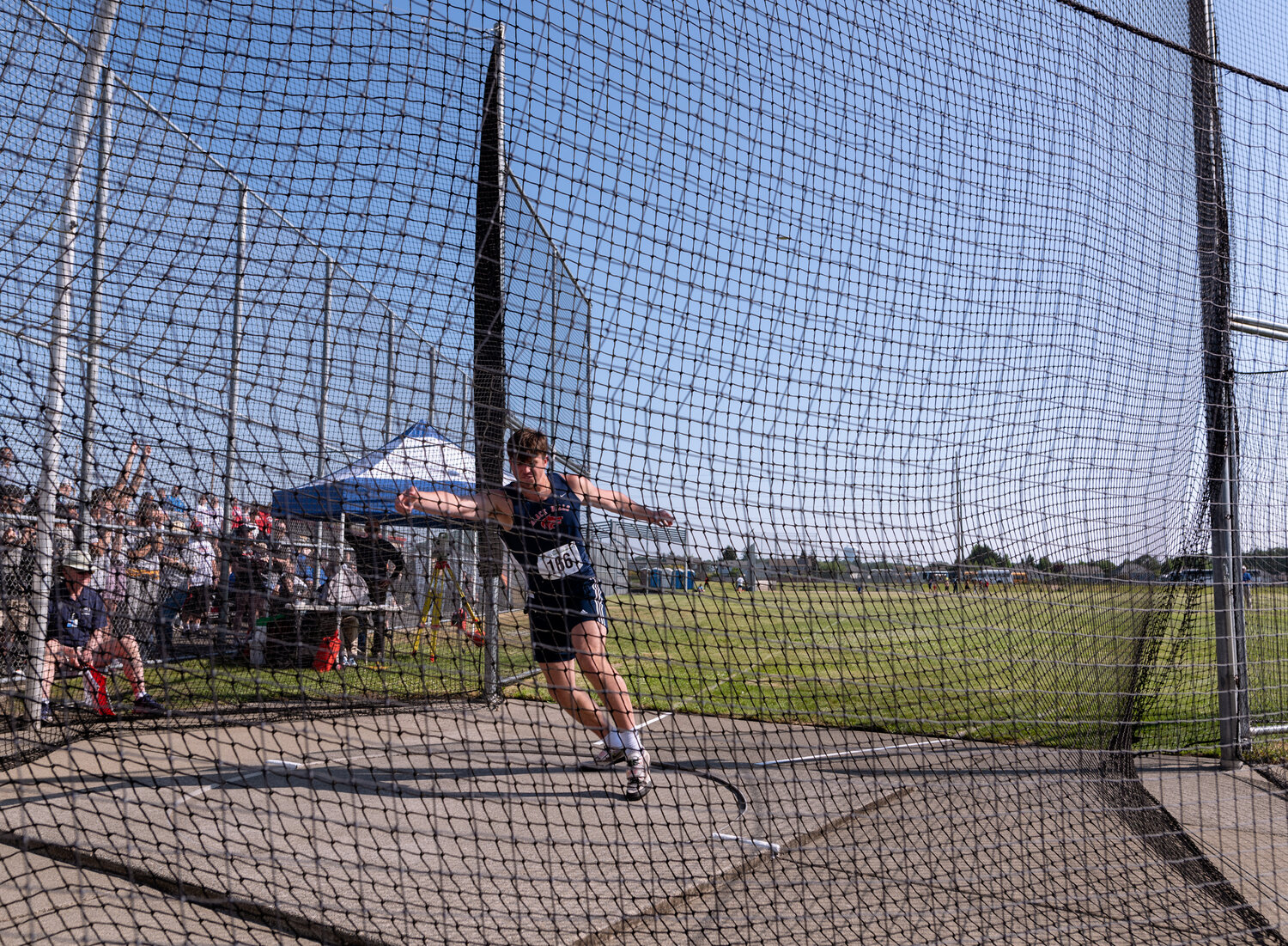 Black Hills’ Liam Wall completes his spin as the disc flies off into the distance during the finals of the 2A boys discus at the WIAA 2A/3A/4A State Track and Field Championships on Thursday, May 25, 2023, at Mount Tahoma High School in Tacoma. (Joshua Hart/For The Chronicle)